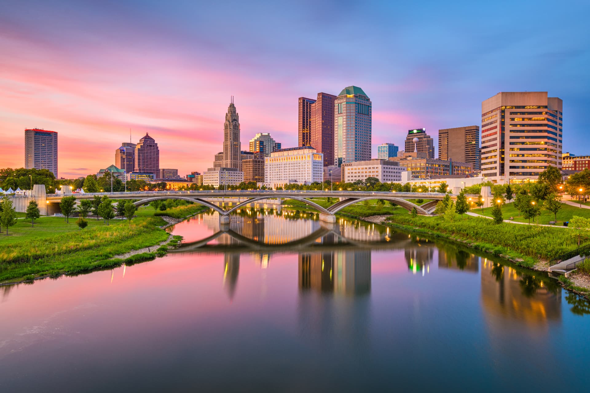 The downtown Columbus, Ohio, skyline at sunset, seen across the Scioto River.